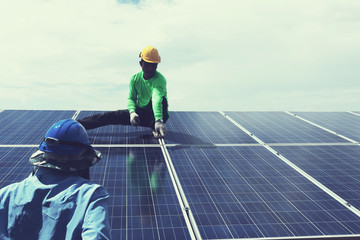 engineer team working on replacement solar panel in solar power plant;engineer and electrician team swapping and install solar panel after solar panel voltage drop