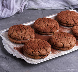 baked round chocolate chip cookies on a silver plate