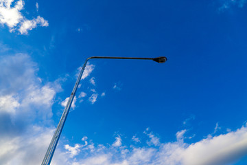 Lamp post and skies