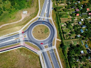 Roundabout intersection in three directions with island, aerial view