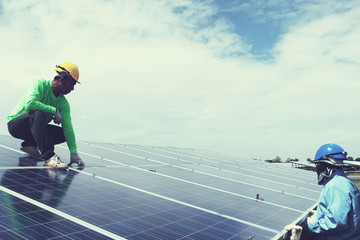 engineer team working on replacement solar panel in solar power plant;engineer and electrician team...