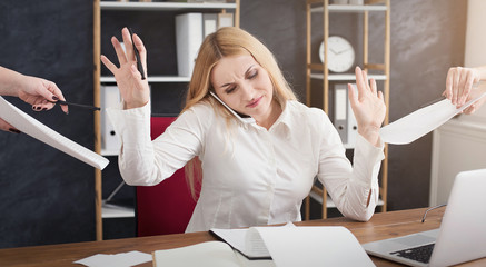 Photo of busy businesswoman refusing to sign documents