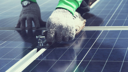engineer team working on replacement solar panel in solar power plant;engineer and electrician team...