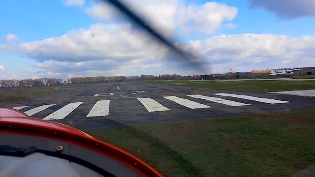 POV from cockpit, light-sport aircraft landing on runway, pilot flight academy