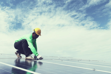 engineer team working on replacement solar panel in solar power plant;engineer and electrician team...
