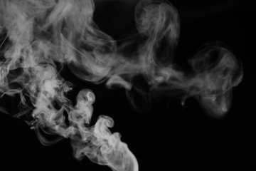 White smoke on a black background. Texture of smoke. Clubs of wh