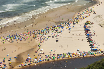 Guarda do Embau beach in the summer crowded with tourists, aerial view - Santa Catarina, Brazil