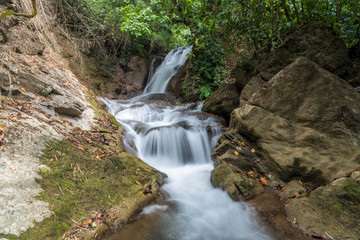 Fototapeta premium Pha-Tak waterfall in deep rain forest at Khao Laem National park, Kanchanaburi, Thailand.