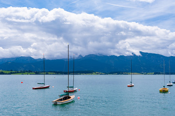 mountain lake with yachts