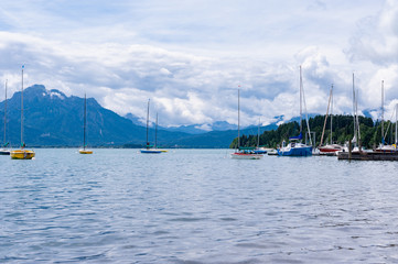 Fototapeta na wymiar mountain lake with yachts
