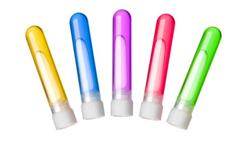 a tube with a stopper and a colored liquid inside isolated on white