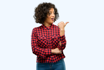 Beautiful arab woman pointing away side with finger