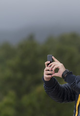 Human hand holding smartphone