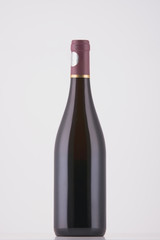 Wine bottle of dark color on white background