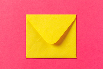 Paper envelopes on a colored pink background