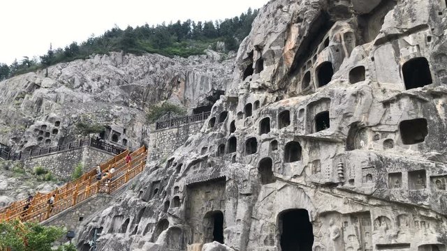 Panning view of the Longmen Grottoes in Luoyang, China
