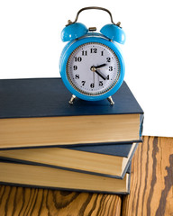 books and alarm clock closeup
