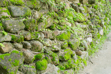 The stones are stacked against the wal