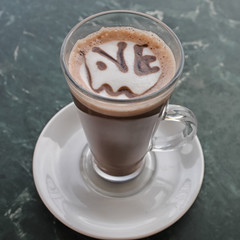 Cup of coffee with the inscription love