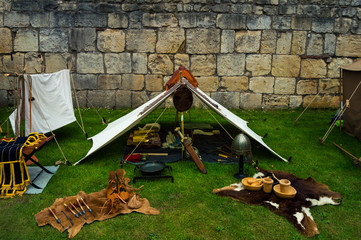 Recreation of a tent in a Roman camp full of weapons, clothes and materials of the time. Life in ancient rome.