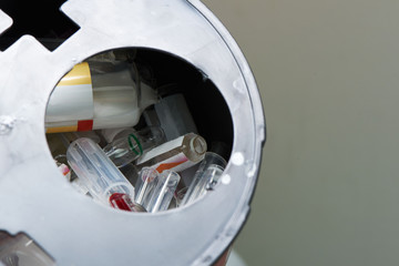 Broken vial of used drug in bioharzard container