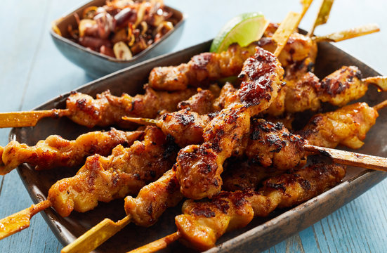 Spicy satay skewers with grilled meat
