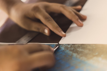 High school students are cutting prints and stickers using knife