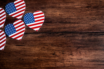 American Independence day background with blue, white and red mixed stars and hearts. Celebration of American independence day, the 4th of July (the Fourth of July). Holiday concept. With copy space. 