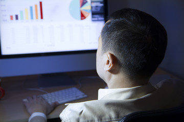 Businessman reviews financial reports and statistic in the office
