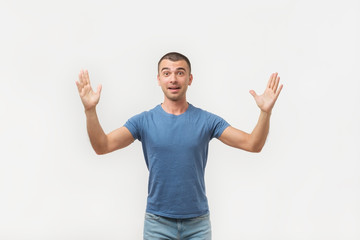 Naklejka premium Happy young hispanic man bragging about the big size of something. He is showing huge size of benefits.