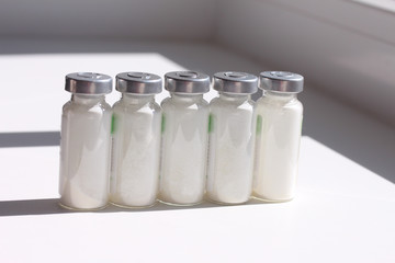 Line vial of medicine powder.
