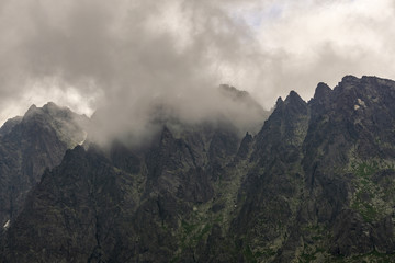 Obraz na płótnie Canvas Gerlach massif between clouds. High Tatras. Slovakia.