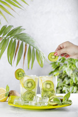 cocktail with kiwi, lemon and mint