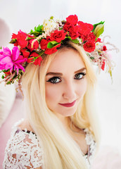 Cute girl in a colored wreath