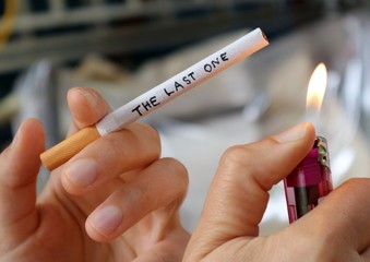 Ignition of the last one cigarette. Quit smoking concept photography.