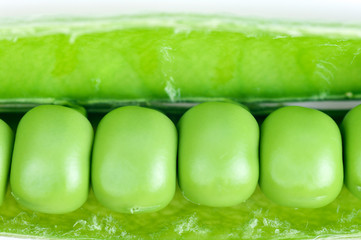 green peas isolated on white background