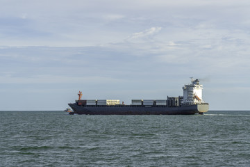Container ship in export and import in the open sea. Cargo delivery and transportation logistics