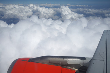 Turbine and wing of airplane in flight.