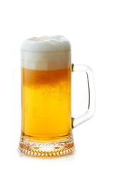 Mug of beer with foam on white