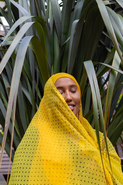 Woman wearing a yellow hijab
