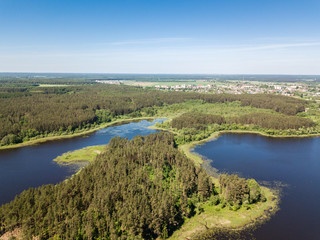 Fototapeta na wymiar Beautiful aerial view of blue lakes and forest Belarus