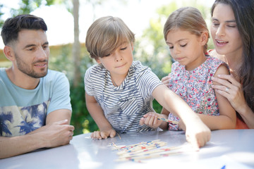 Happy family enjoying playing game together