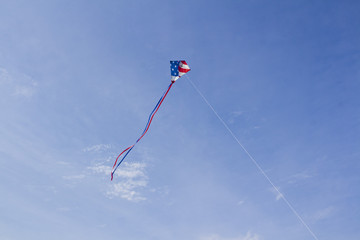 American Flag Kite Flying on a Bright Blue Sky