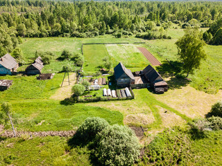 Beautiful aerial view of private farm in field on summer day