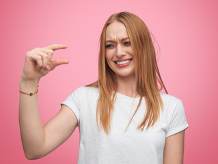 Laughing girl mocking at small size