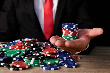 Naklejka premium Gambling Concepts. Business people are gambling in the casino. Betting is a gamble for investors.