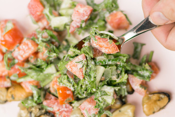 Fried mussels with fresh vegetable salad.
