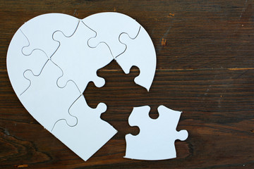 White heart puzzle with a missing piece
