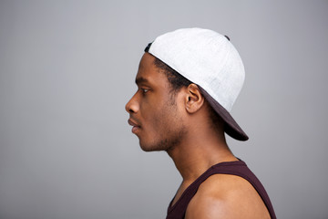 Close up profile african american man with cap on backwards