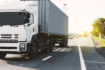 Truck on highway road with container, transportation concept.,import,export logistic industrial Transporting Land transport on the asphalt expressway.